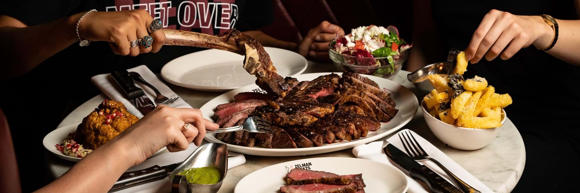 Couple Dining At Zelman Meats Restaurant In London